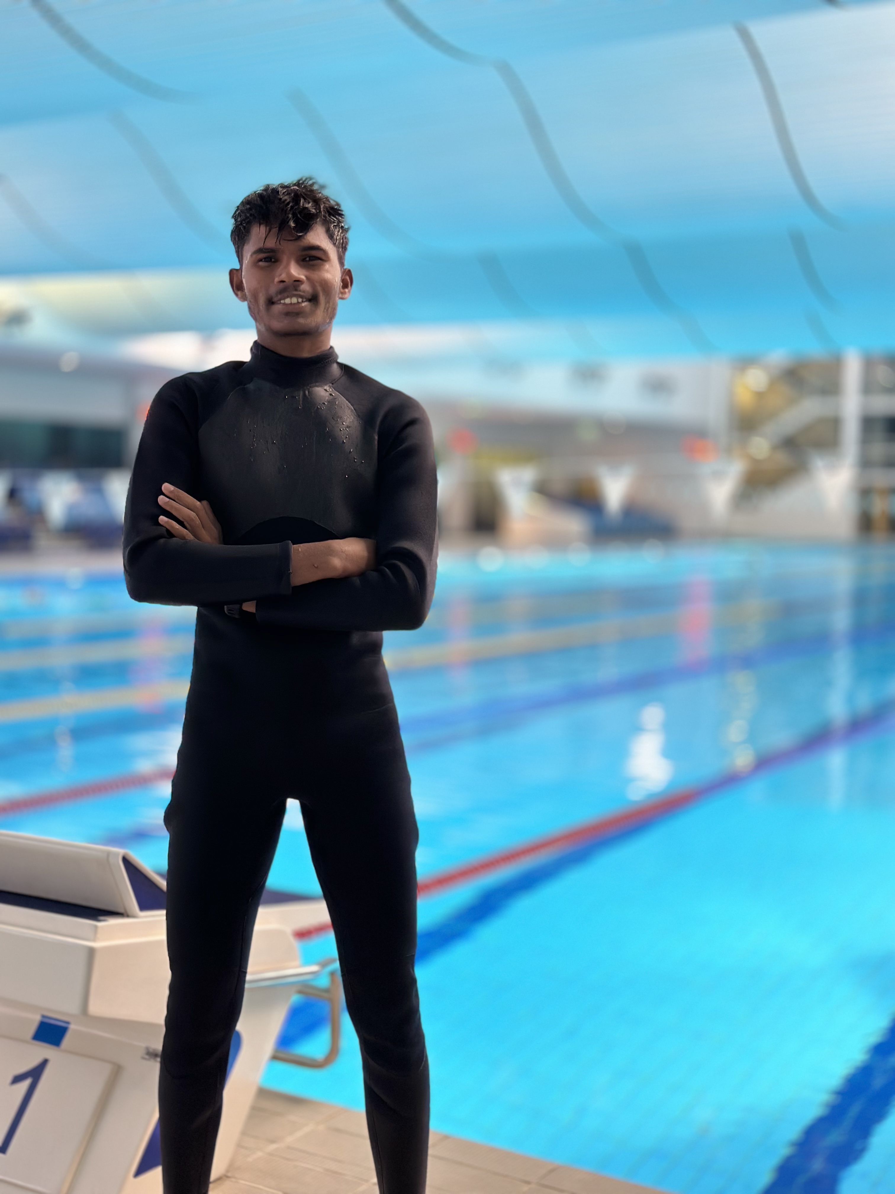 Sea Critter's lead facilitator, poolside in a wetsuit